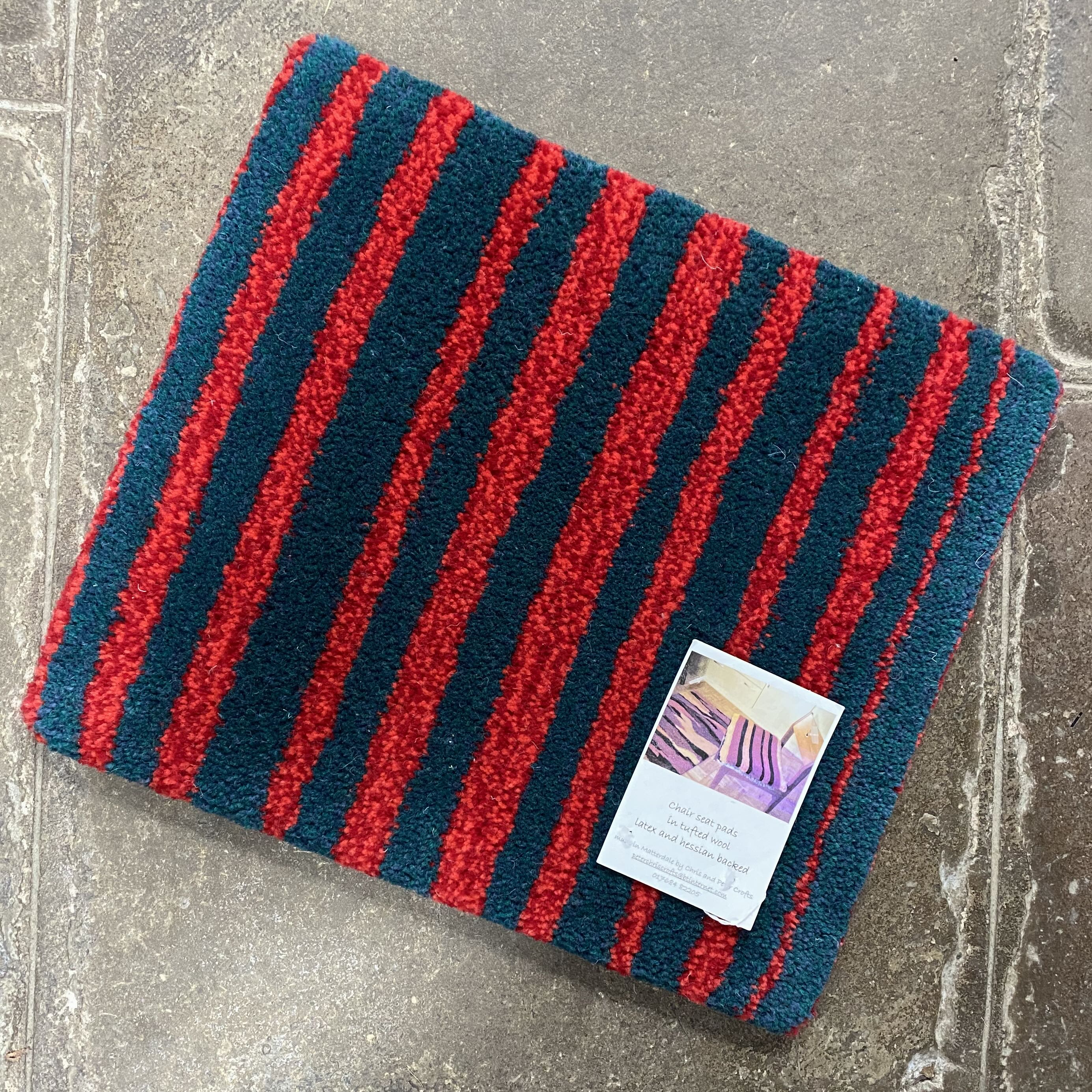 Tufted woollen seat pad - Red/Green Stripes